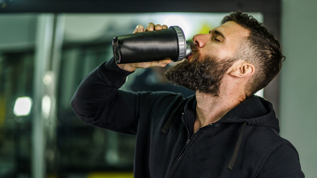 A man drinking creatine