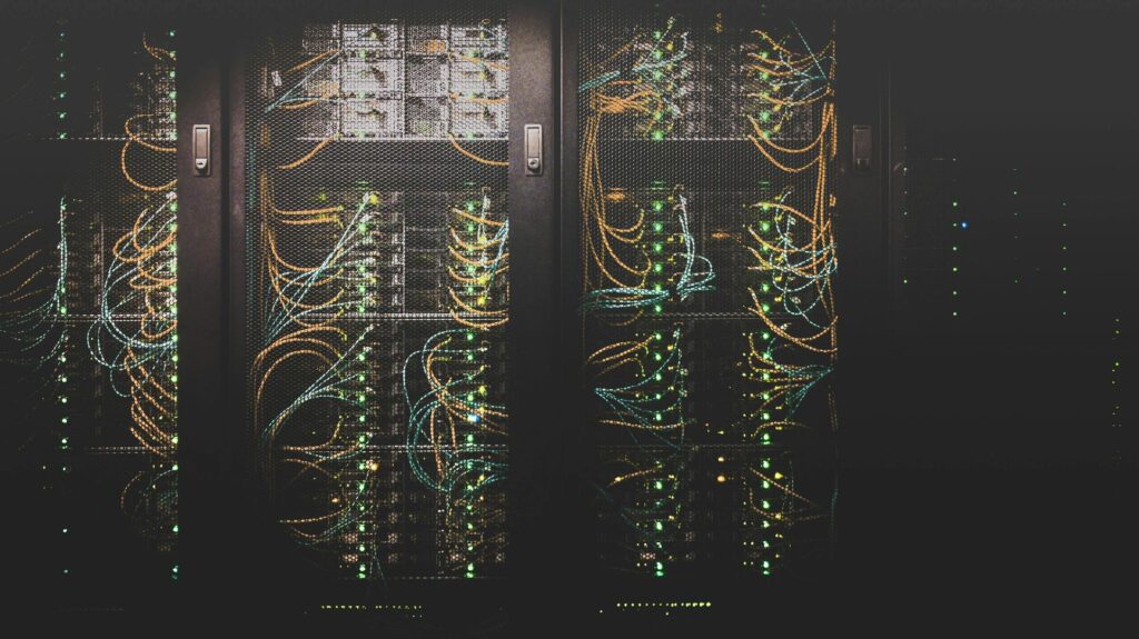 You’ll be as annoyed as me when you learn how much energy a few seconds of AI video costs Data servers with colourful wires inside a meshed metal cupboard