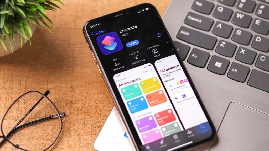 iOS Shortcuts app on iPhone place on top of MacBook