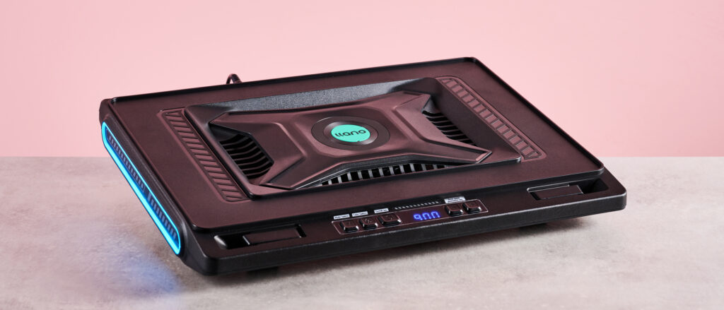 Llano V10 Gaming Laptop Cooling Pad review: freezing cold performance squeezed by its even more powerful and much cheaper rivals The Llano V10 Gaming Laptop Cooling Pad at a 3/4s angle with RGB lighting in front of a pink background.