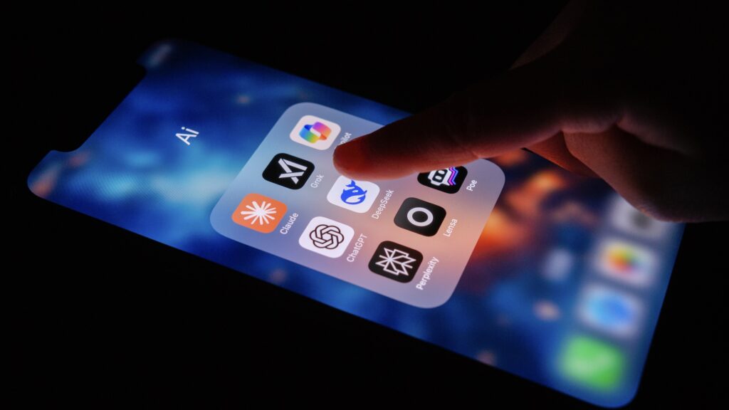 AI apps on smartphone screen, finger tapping on DeepSeek app