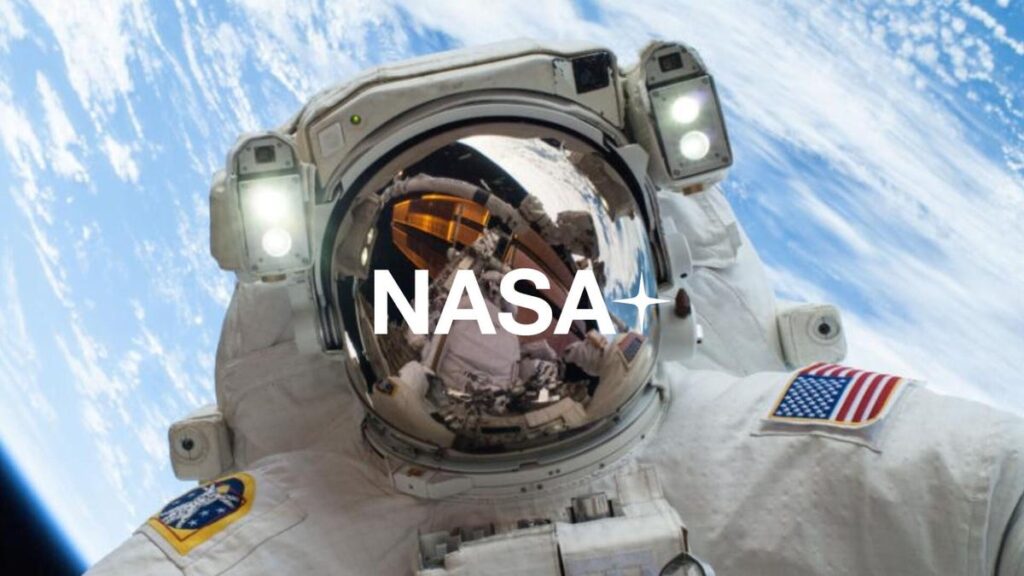 astronaut with nasa plus written across helmut