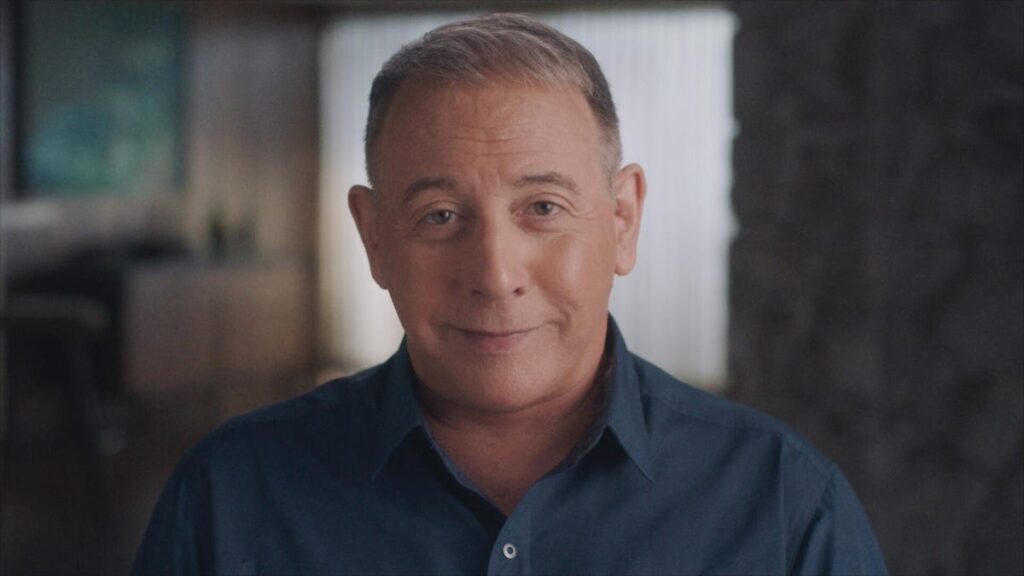 Actor Paul Reubens looks into the camera