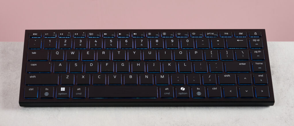 Razer Joro on desk with pink background