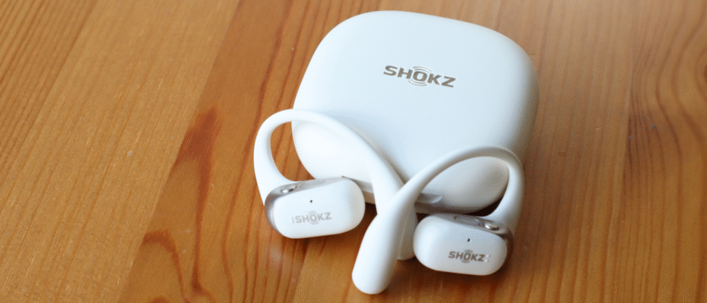 Shokz OpenFit 2 on a wooden table