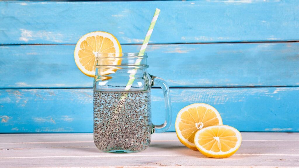 Chia seed water with lemon with blue background.