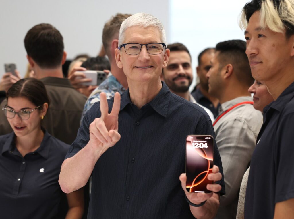 WWDC 2025: What to expect from this year’s conference Apple CEO Tim Cook inspects the new iPhone 16 during an Apple special event at Apple headquarters.