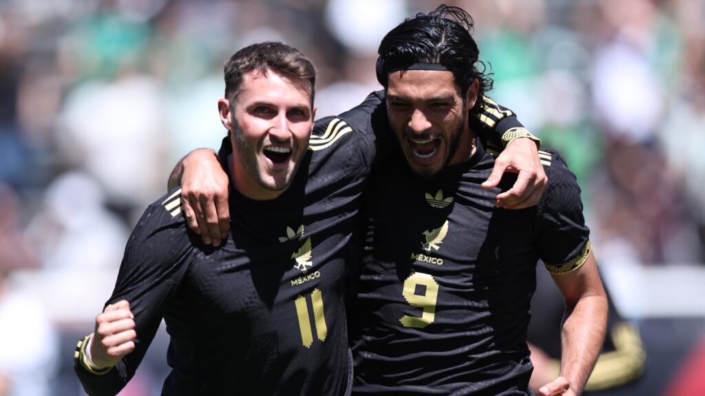 Santiago Gimenez #11 of Mexico celebrates after scoring his teammates first goal with his teammate Raul Jimenez #9