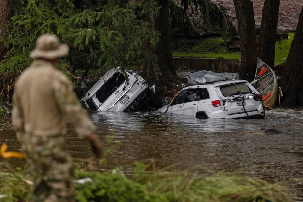 earch and rescue workers search near debris looking for any survivors or remains of people swept up in the flash flooding on July 6, 2025 in Hunt Texas.