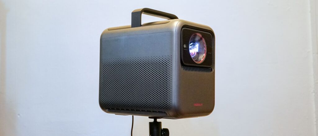 An Anker Nebula X1 laser projector on a stand