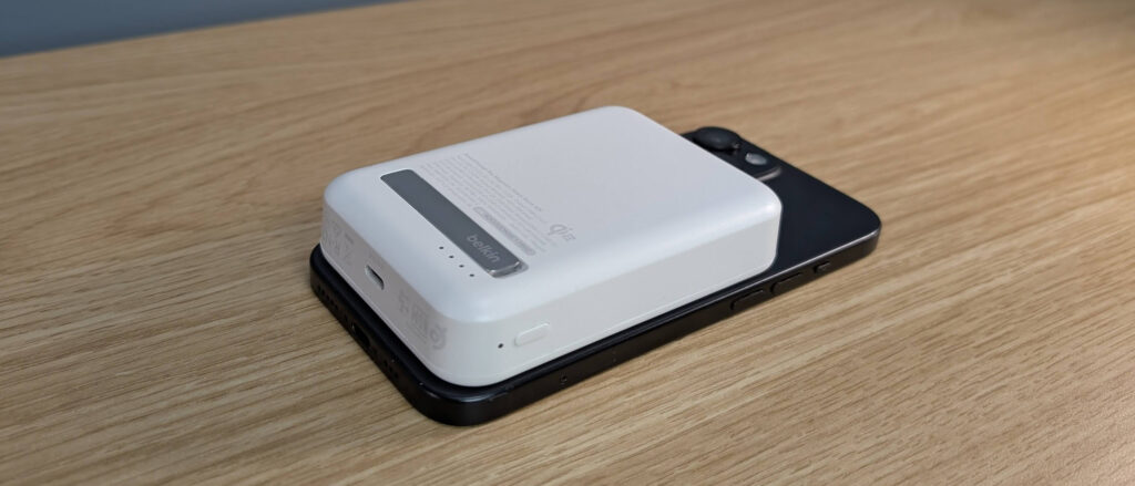 Belkin Boostcharge Pro 15W qi2 power bank sitting on an iPhone 15