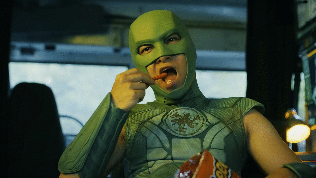 HBO’s superhero show that truly blew my mind finally gets a season 2 trailer Peacemaker Season 2 – Nhut Le as Judomaster in the back of a van eating Cheetos