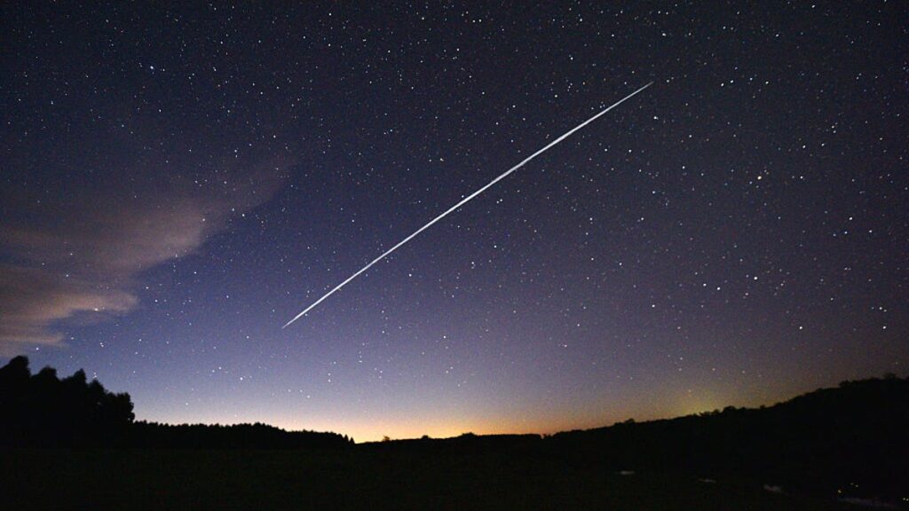 Nearly 500 Starlink Satellites Have Incinerated in Earth’s Atmosphere So Far This Year a shooting star racing towards the dawn