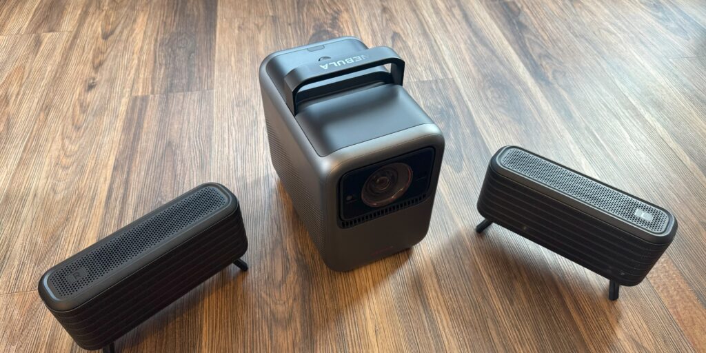 Anker Nebula X1 with speakers on floor