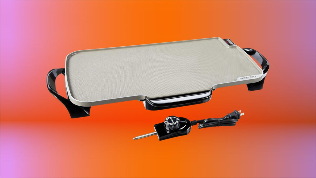 A rectangular ceramic griddle with black side handles and a black electric cord, set against an orange and pink background.