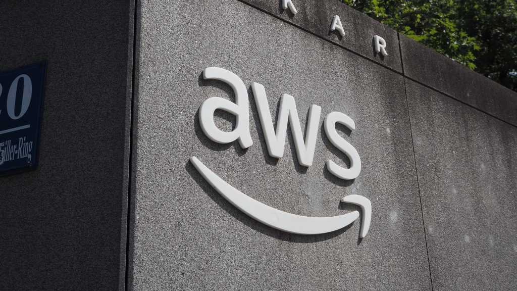 Hackers can slip ghost commands into the Amazon Q Developer VS Code Extension AWS logo on wall