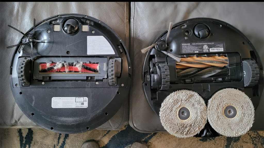 Robot Vacuum Not Cleaning Well? I Asked an Expert How to Fix It Two robo vacuums side by side with rollers exposed.