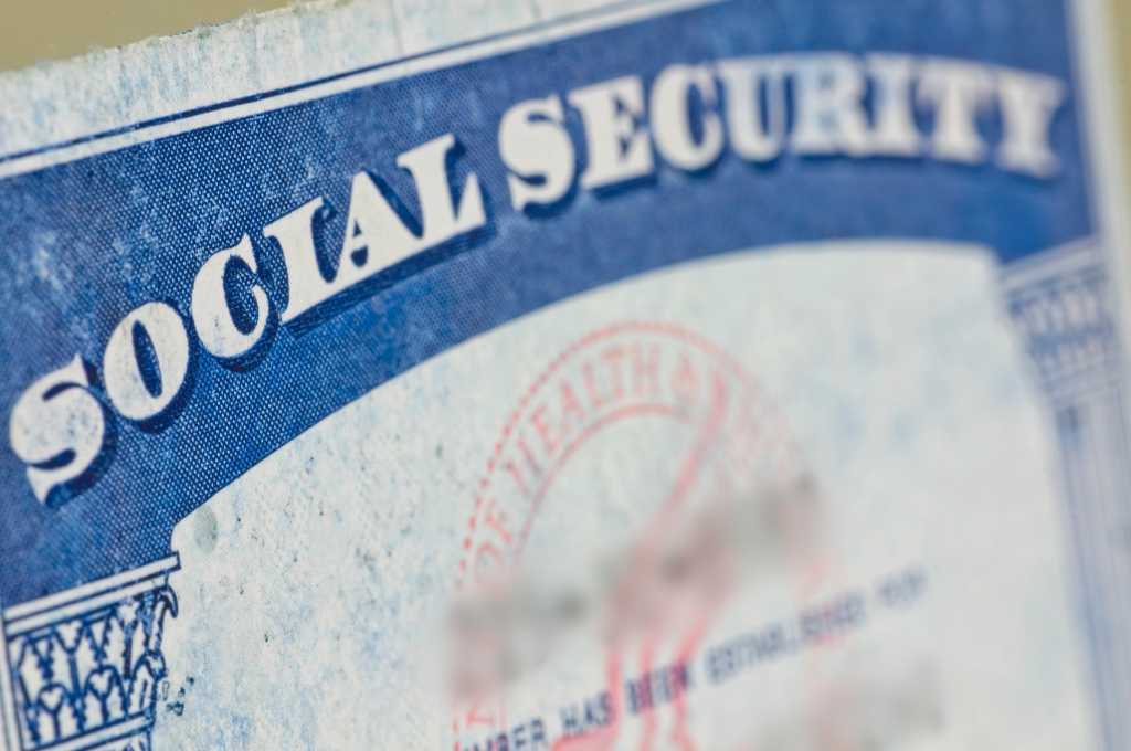 Whistleblower: DOGE put Social Security database covering 300 million Americans on insecure cloud Old social security card on yellow straw table.