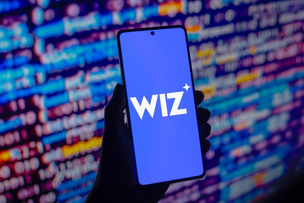 Vibe coding? Meet vibe security Wiz logo displayed on a smartphone