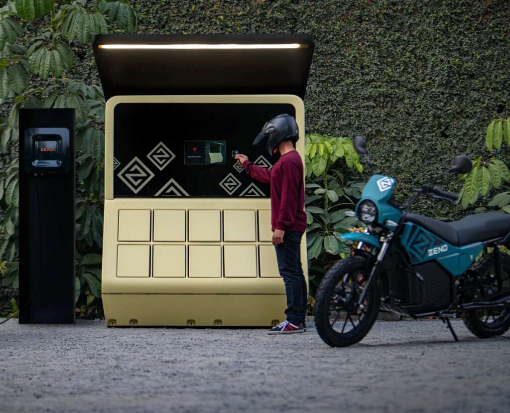 A man swaps batteries for an electric motorbike.