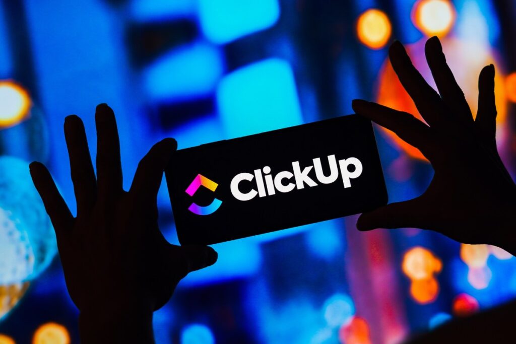 What ClickUp’s mass layoff tells us about the future of work ClickUp logo on a smartphone
