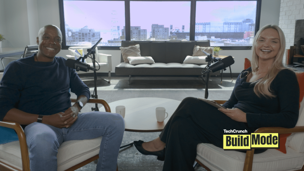 Charles Hudson shares the common mistakes he’s seen after investing in 500+ startups TechCrunch Build Mode podcast host Isabelle Johannessen sits across from venture capitalist Charles Hudson in a bright podcast studio. Both are smiling toward the camera, seated in armchairs with microphones positioned between them. A coffee table with two mugs sits in the foreground, while large windows behind them overlook the San Francisco skyline. The TechCrunch Build Mode logo appears in the bottom-right corner.